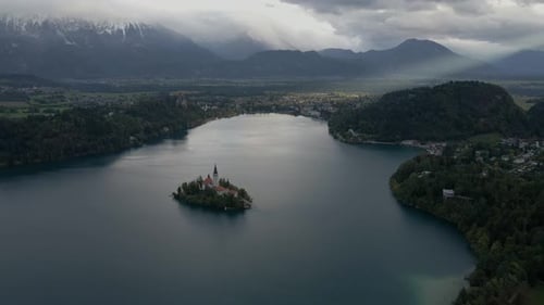 Aerial view of Lake Bled with church, island, and Julian Alps, Bled, Slovenia.