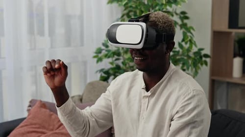 Close View of the African American Man Use Vr Headset Glasses at Home for Studying Purposes