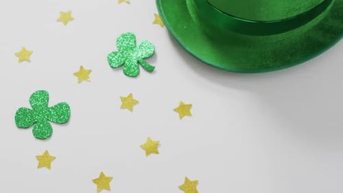 Shamrocks and stars with green hat with copy space on white background