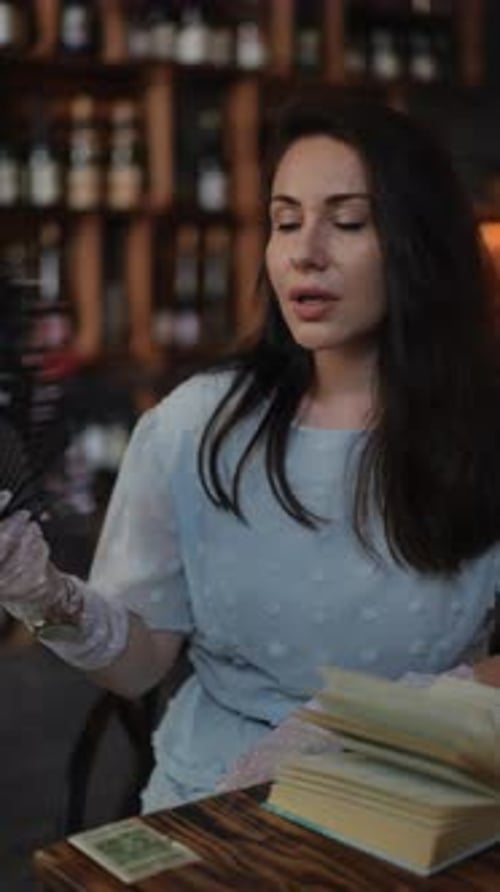 Woman with Wine Glass in Cafe