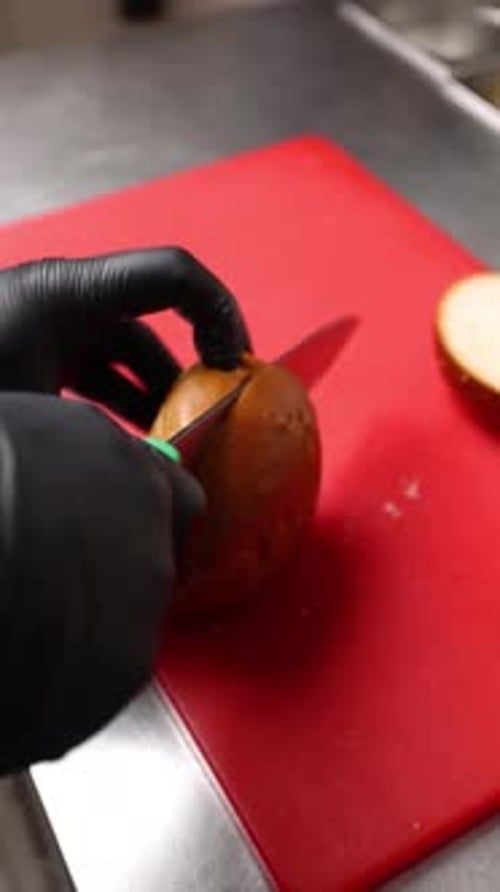 Cutting a Burger Bun in a Commercial Kitchen