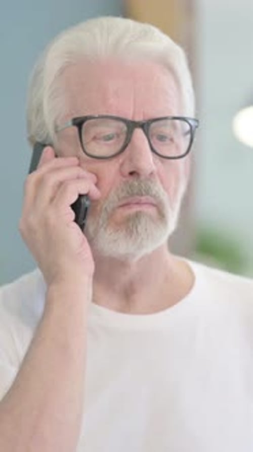 Senior Man Talking on Mobile Phone