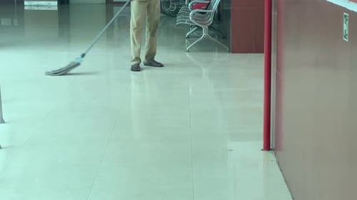 A man is mopping the floor