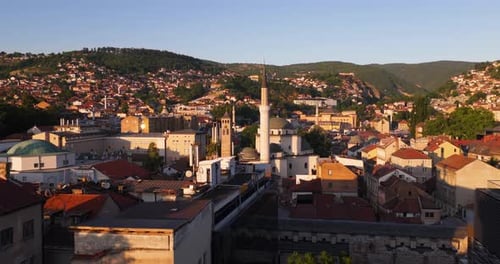 Flying Through Sarajevo Skyline At Sunset With Gazi Husrev-beg Mosque And Historic Buildings In