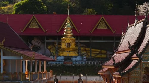 Wat Pong Yaeng Nok Buddhist Temple with Its Red Roof Golden Chedi and Large Reclining Buddha Statue