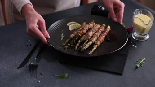 Asparagus Wrapped in Bacon Served on Plate