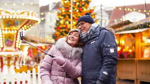 Couple Taking Selfie at Festive Christmas Market