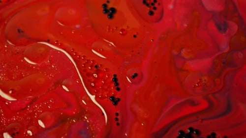 The Movements of Oil Bubbles and Paint Interact to Create Unique Textures