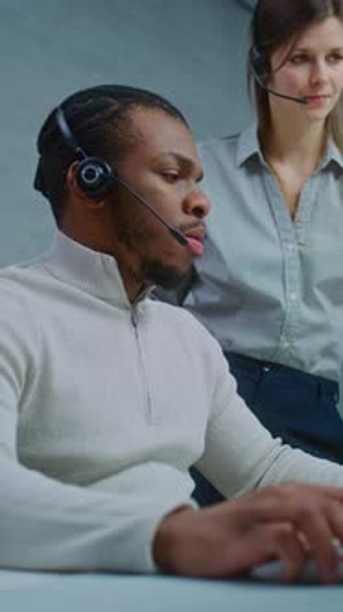 Focused Professional Working with Colleague in Modern Office