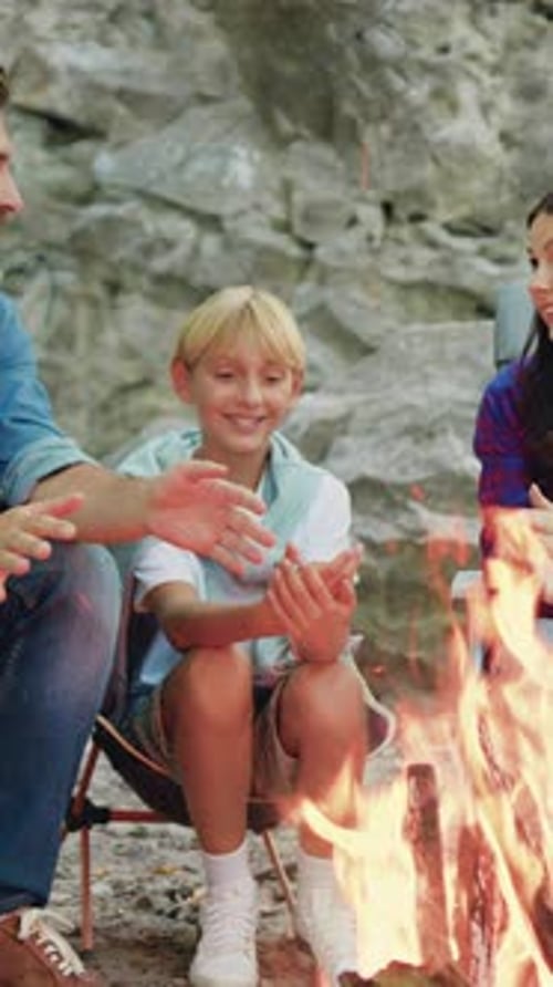 Happy Smiling Family Parents with Children Warming Their Hands By Fire During Weekend Picnic at