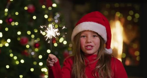 Excited Child Celebrates Christmas with Sparkler