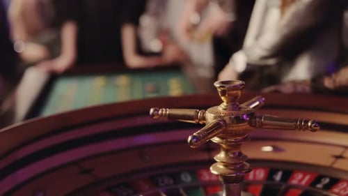 People play poker roulette at the table. Friends playing in the casino.