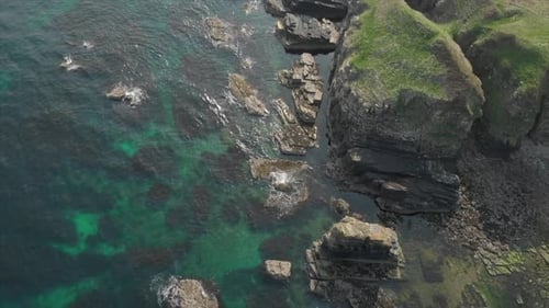 Aerial view of a rocky beach in Scotland.