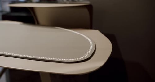 Close Up Work Table with Leather and White Stitching Wood on a Comfortable Room