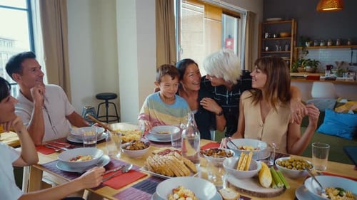 Family Enjoying Meal Together at Home Dining Table