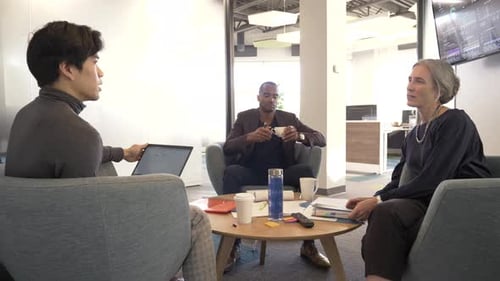 Colleagues Meeting to Discuss Business at Office