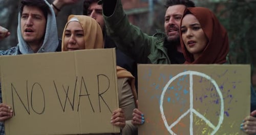 Diverse Group Protesting Against War in Urban Setting