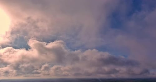 Dramatic Aerial View of Peach Colored Clouds at Sunrise