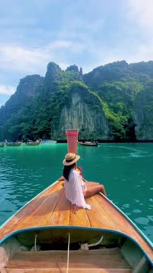 Pileh Lagoon with Green Emerald Ocean at Koh Phi Phi Thailand Women in Front of Longtail Boat