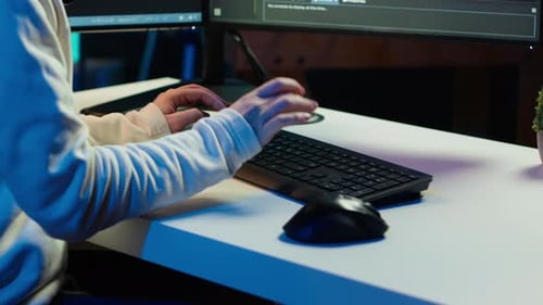 Teleworking Computer Technician Typing on Keyboard Close Up