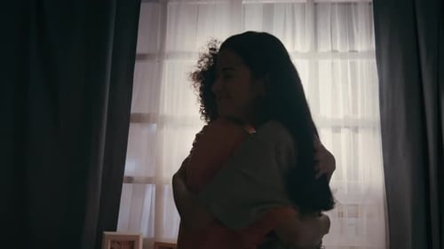 Child and Young Adult Share a Heartfelt Hug