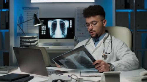 Doctor Examining X-Ray During Telemedicine Appointment