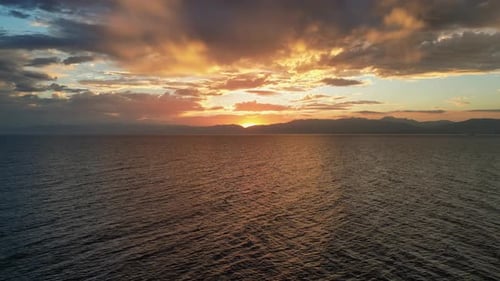 Beautiful Fire Sunset Over Calm Ocean, Drone View