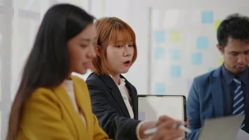 Professionals Discussing Business Project During Meeting