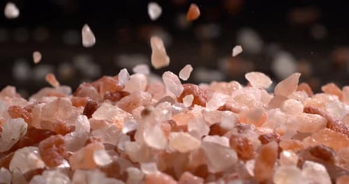 Himalayan pink salt in a super slow motion, natural mineral seasoning for healthy cooking and spa