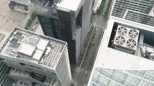 Epic Drone Twist Above Tall Office and Apartment Building Roofs Austin Downtown