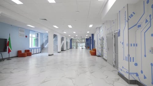 School Hallway with Soft Benches and Classroom Doors