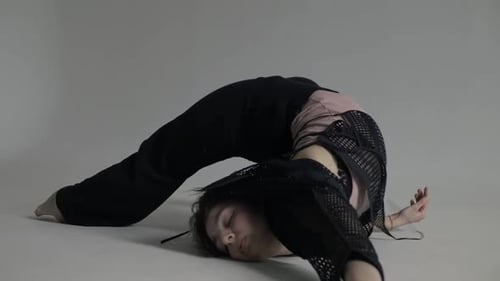 Young Woman Dancing Expressively in Studio