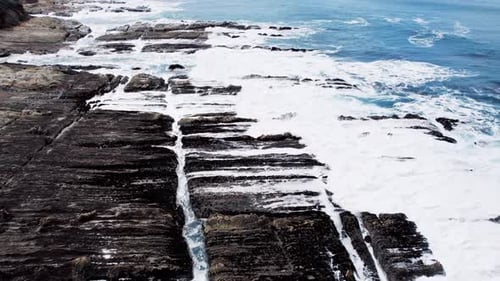 Dramatic Ocean Cliffs on the West Coast with Waves Crashing Against Rocks