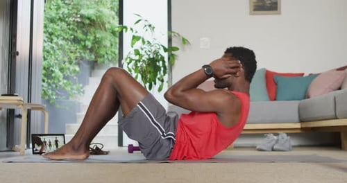 Athletic Man Doing Sit Ups at Home