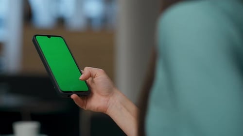 Unrecognizable Executive Typing Green Screen Smartphone at Lobby