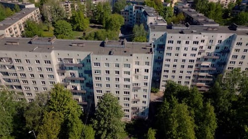 Tilt down on massive concrete Russian apartment blocks in ghetto suburb