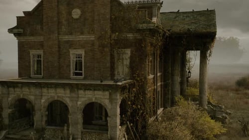 Eerie Abandoned Mansion with Overgrown Vines and Foggy Sky