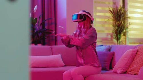 Woman Enjoys Virtual Reality Experience on Couch at Home
