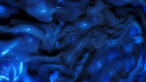 Tintas líquidas azuis giratórias com fumaça de purpurina na arte abstrata