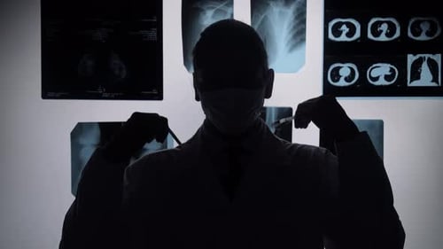 Doctor Analyzing X Ray Images in a Medical Clinic Environment