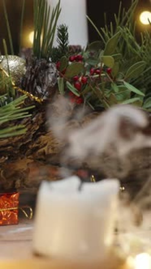 Vertical video. Decorations and Christmas tree toys, I blow out the candle and approach closer