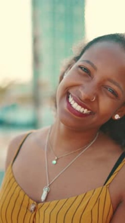 Closeup of smiling woman on urban city background