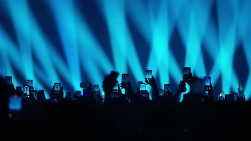 Concert Crowd Recording with Smartphones Under Blue Lights