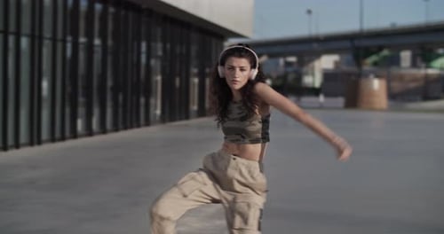 Graceful Woman Dancing in Morning in City