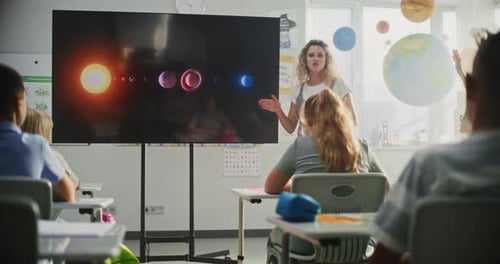 Elementary School Students Studying Basic Information About Solar System and Planets