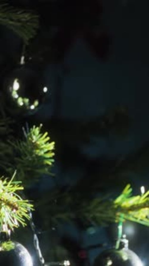 Silver Christmas Balls On The Tree At Night Eve