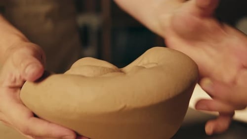 Man Potter Works with Clay on Master Class in Studio Working Process in Ceramic Workshop Potter