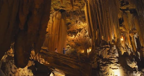 Couple exploring stalactites and stalagmites in luray caverns Virginia