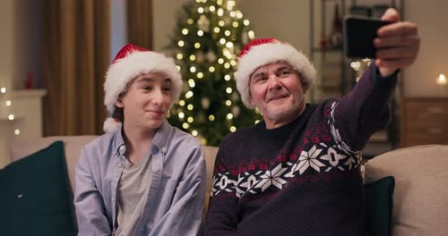 Smiling Family Waving on a Video Call at Christmas