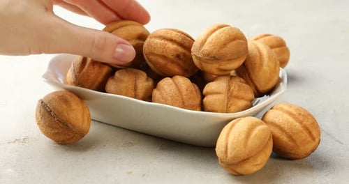 Delicious walnut shaped cookies served in bowl